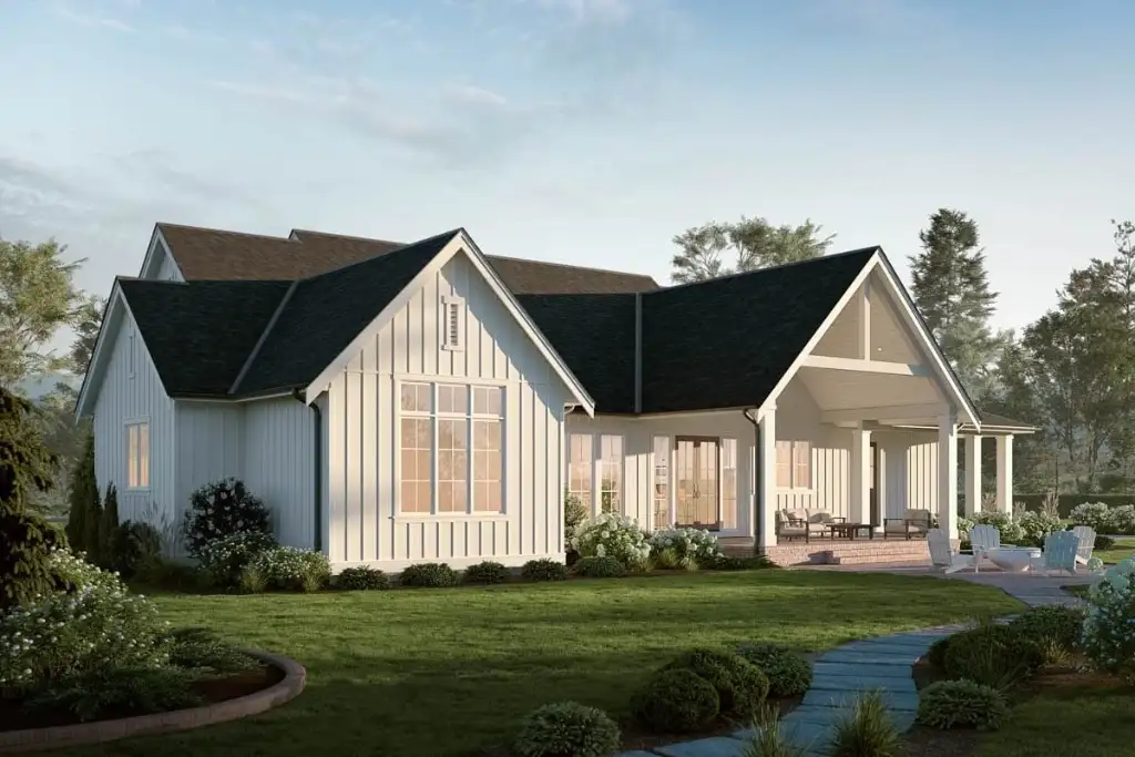 Rear elevation of plan 270128AF showing the covered patio, French doors and Adirondack seating