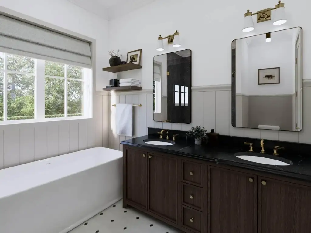 Primary ensuite with a freestanding soaker tub, walnut double vanity, black soapstone counter and brass fixtures