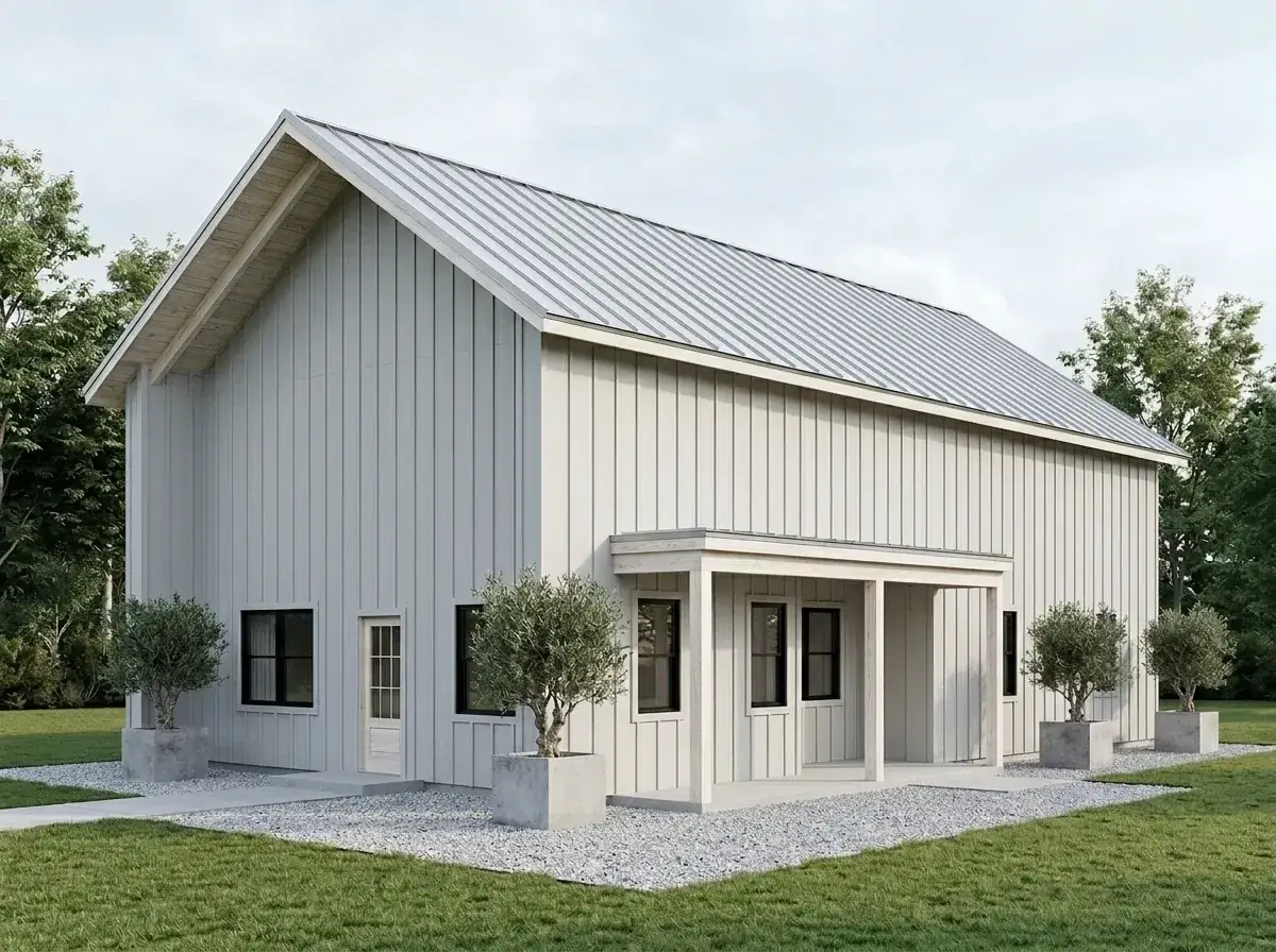 Modern white barn facade with crisp white vertical siding, light grey metal roof, and black window frames