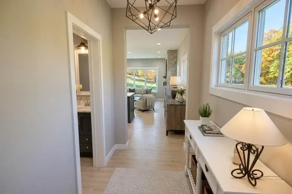 Upper hall connecting loft, primary suite, and secondary bedrooms
