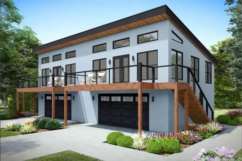 Modern duplex front entry with stacked decks and dark window frames